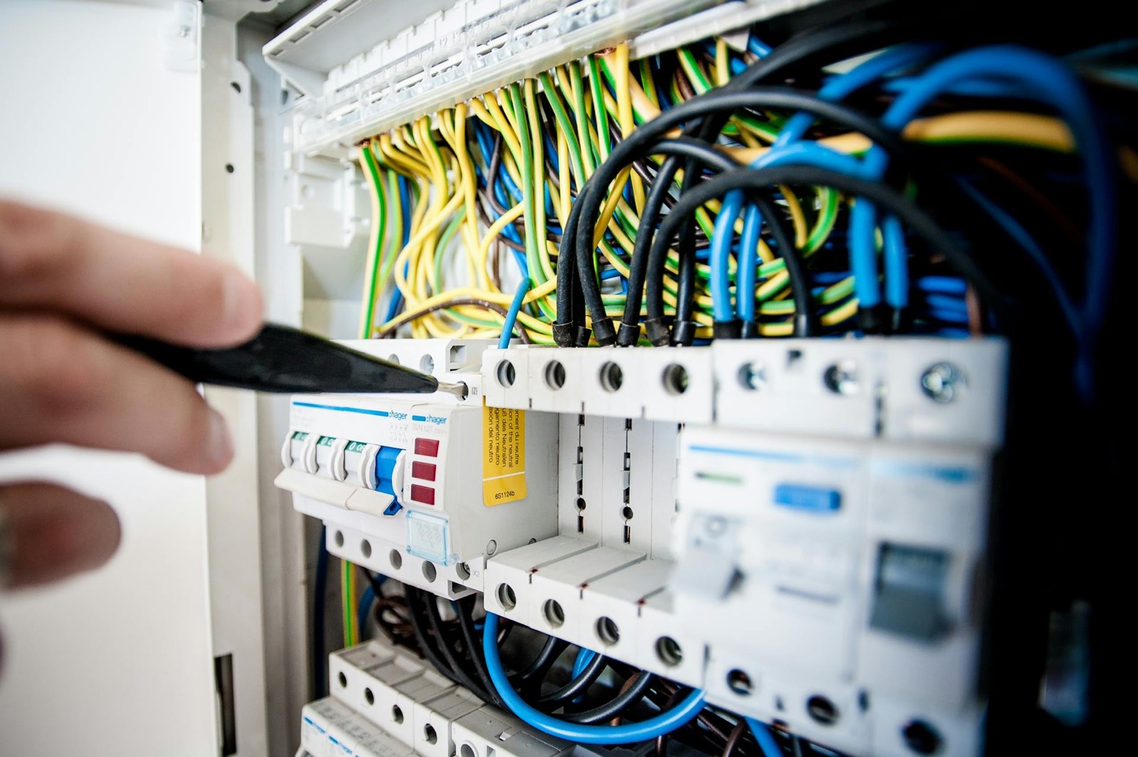 Electrician working on a commercial switchboard