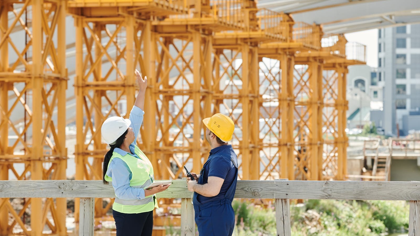 Two experienced facility professionals reviewing work at a commercial property